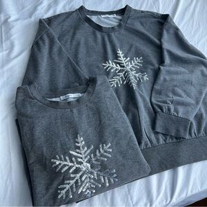 Ricki’s grey Sweatshirt with Silver Snowflake Design